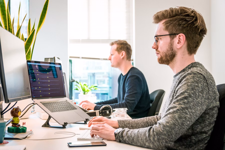 Software team collaborating in a modern workspace